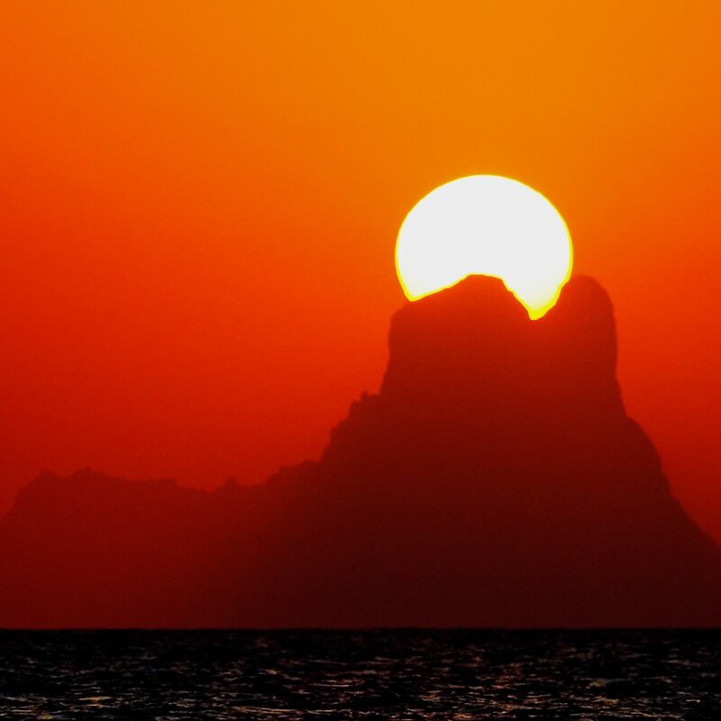 Sunset behind a rock formation