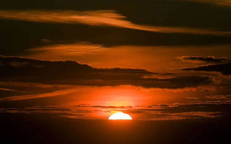 Sunset behind clouds