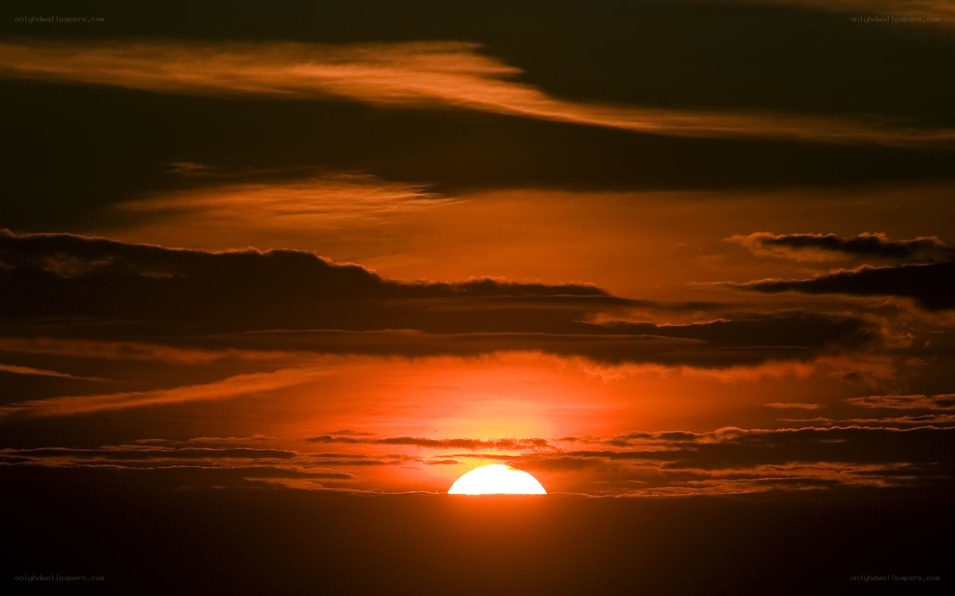 Sunset behind clouds