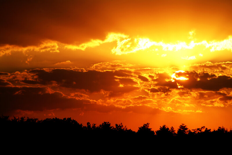 Sunset behind clouds