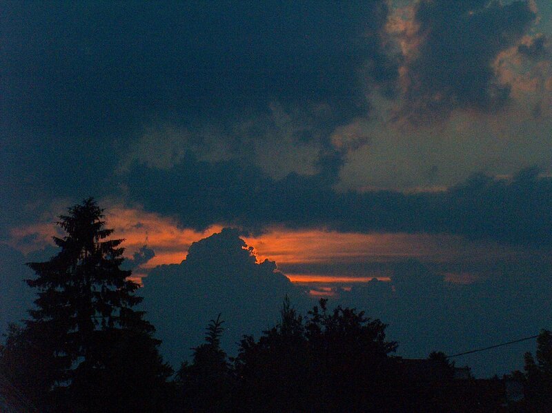 sunset behind clouds