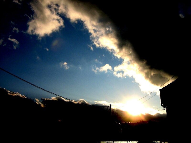 Sunset behind clouds