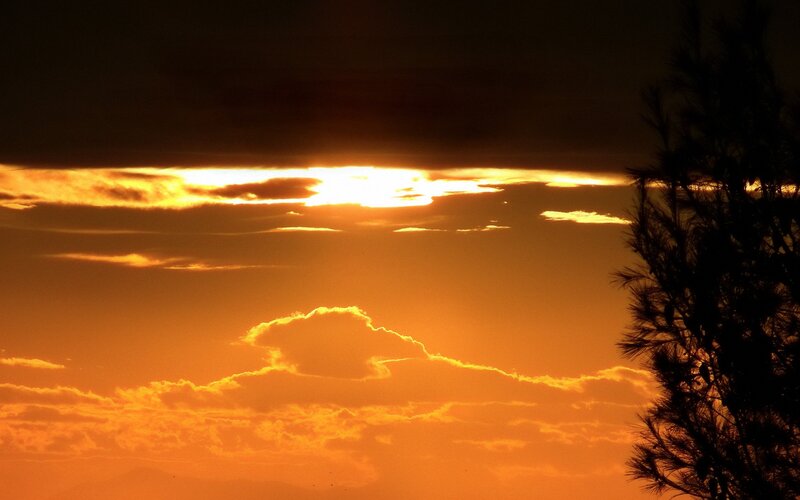 Sunset behind clouds