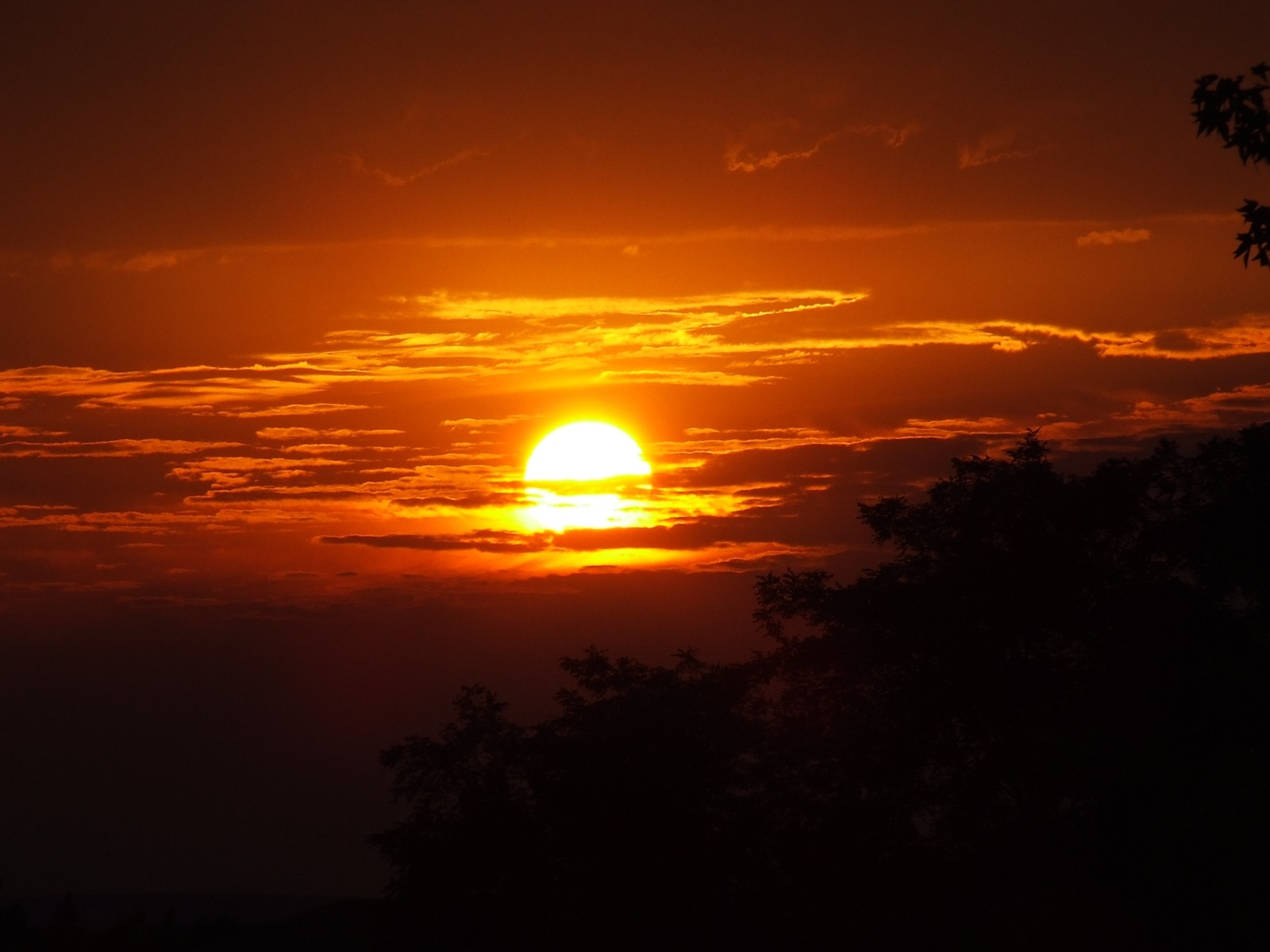 Sunset behind clouds