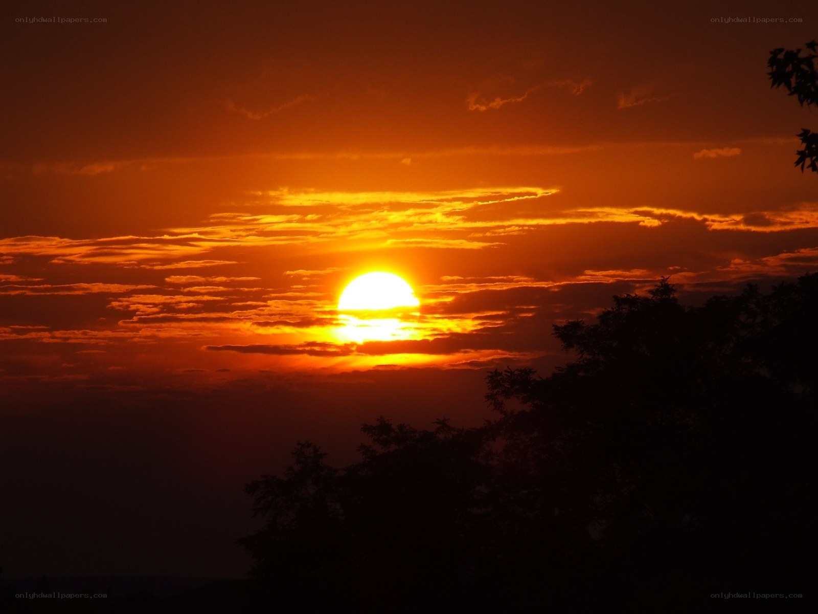 Sunset behind clouds