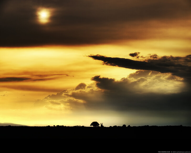 Sunset behind clouds