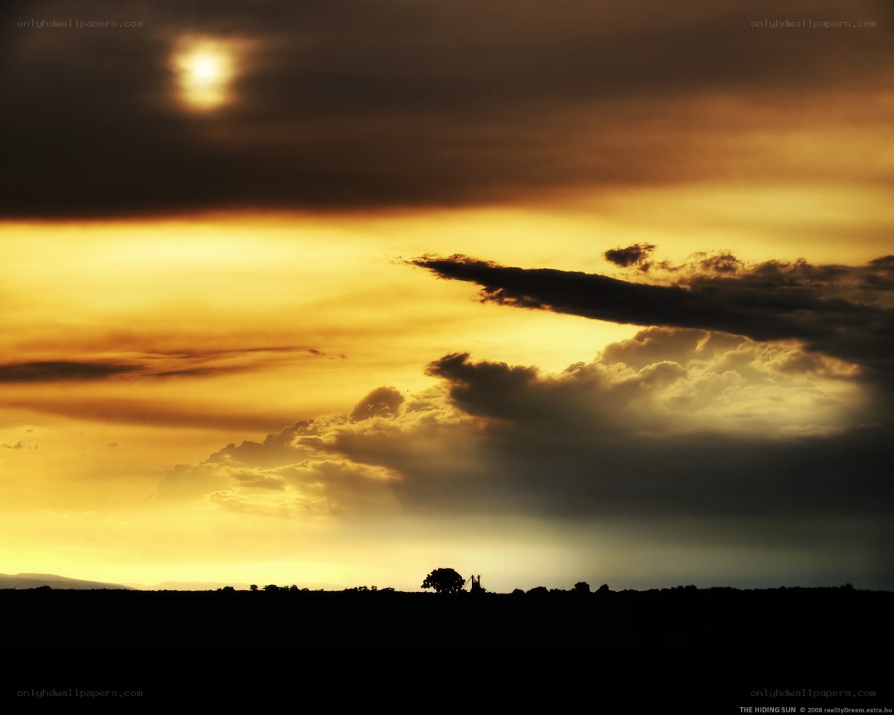 Sunset behind clouds