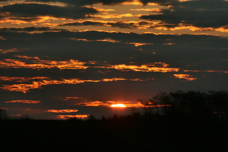 Sunset behind clouds