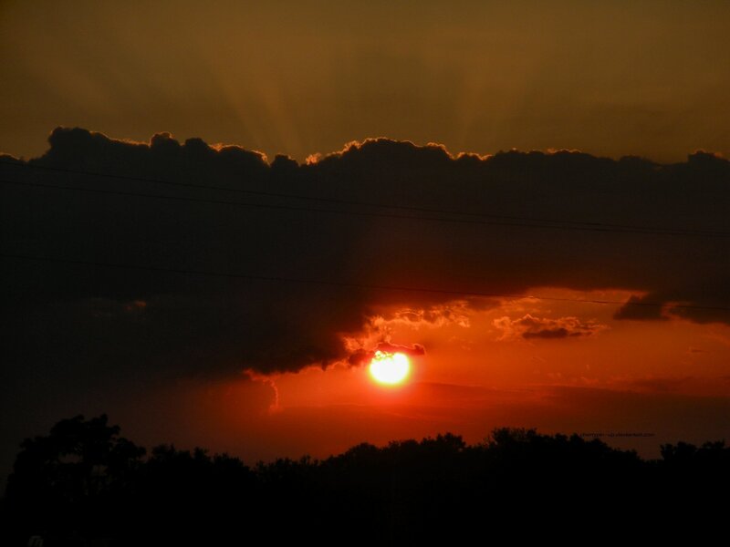 Sunset behind clouds
