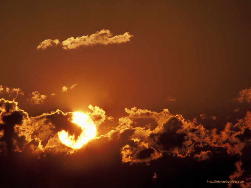 Sunset behind clouds