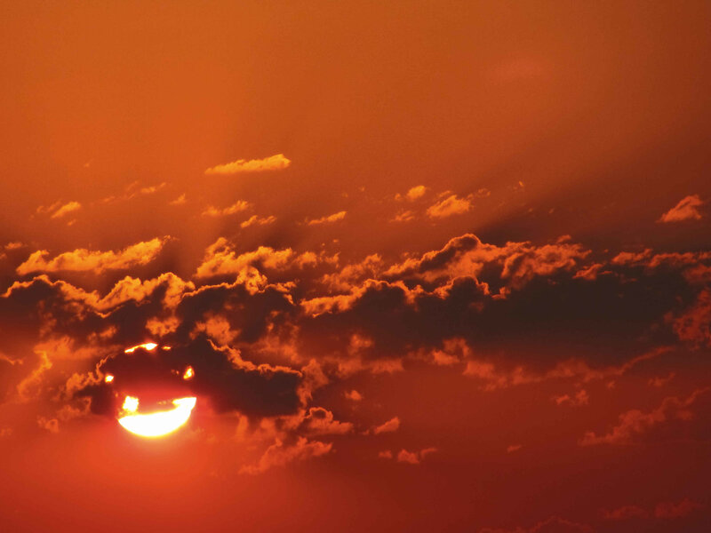 Sunset behind clouds