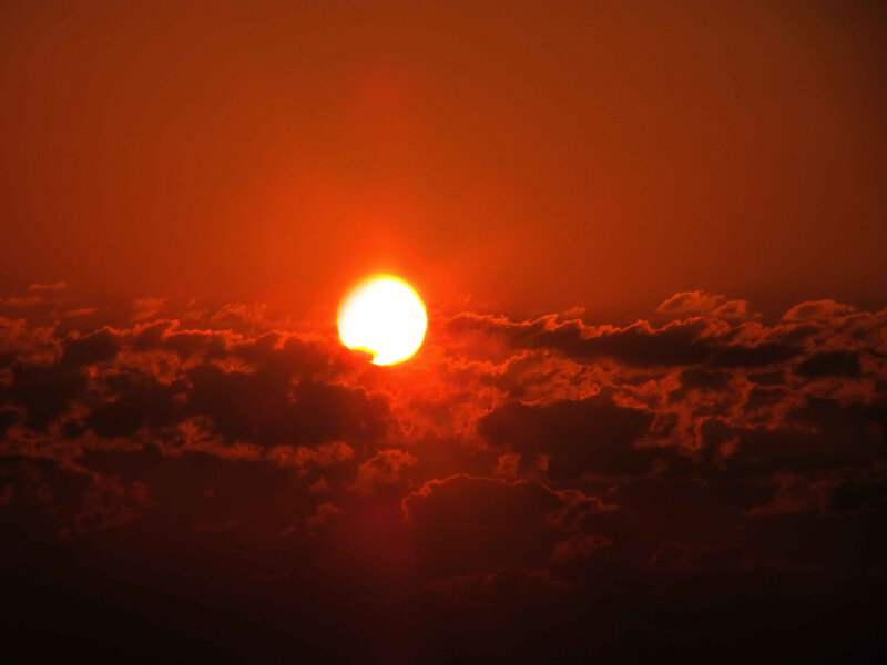 Sunset behind clouds