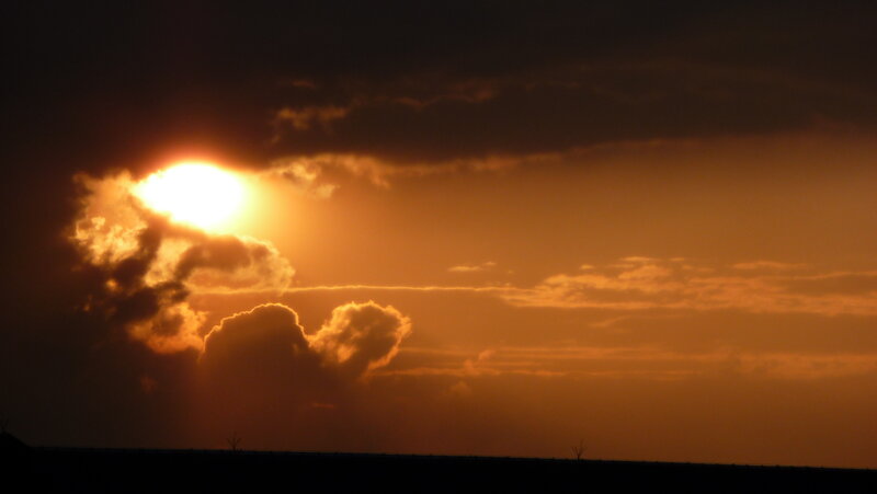 Sunset behind clouds