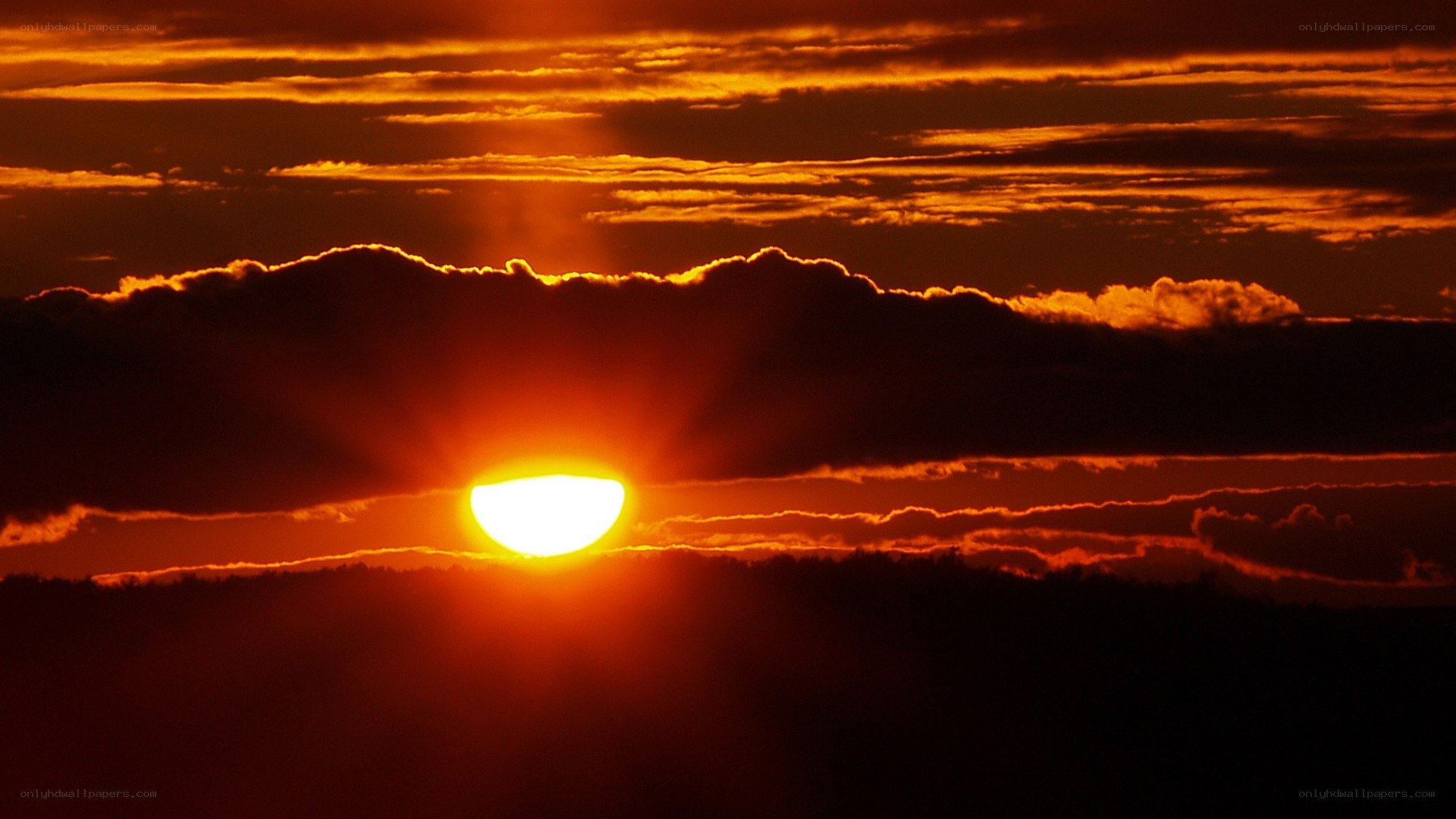 Sunset behind clouds