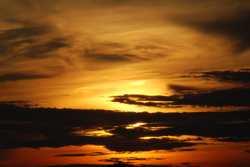 Sunset Behind Clouds — Orange, Dramatic, Photograph, Sun