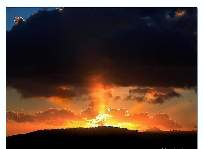 Sunset behind dark clouds