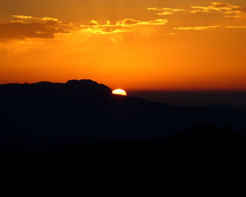 Sunset behind mountain silhouette