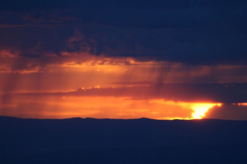Sunset behind mountain silhouettes