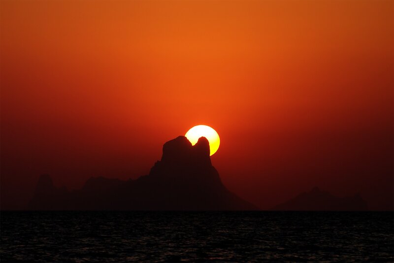 Sunset behind rock formation