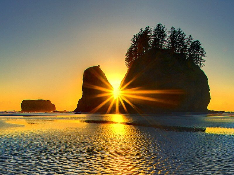Sunset behind sea stacks