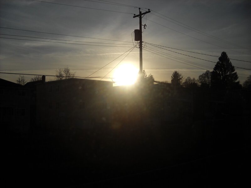 Sunset behind utility pole