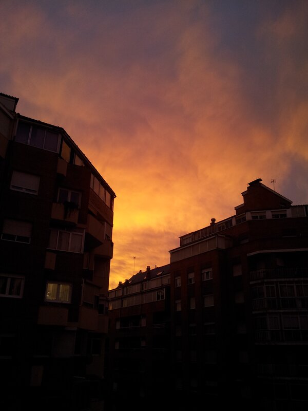 sunset between apartment buildings