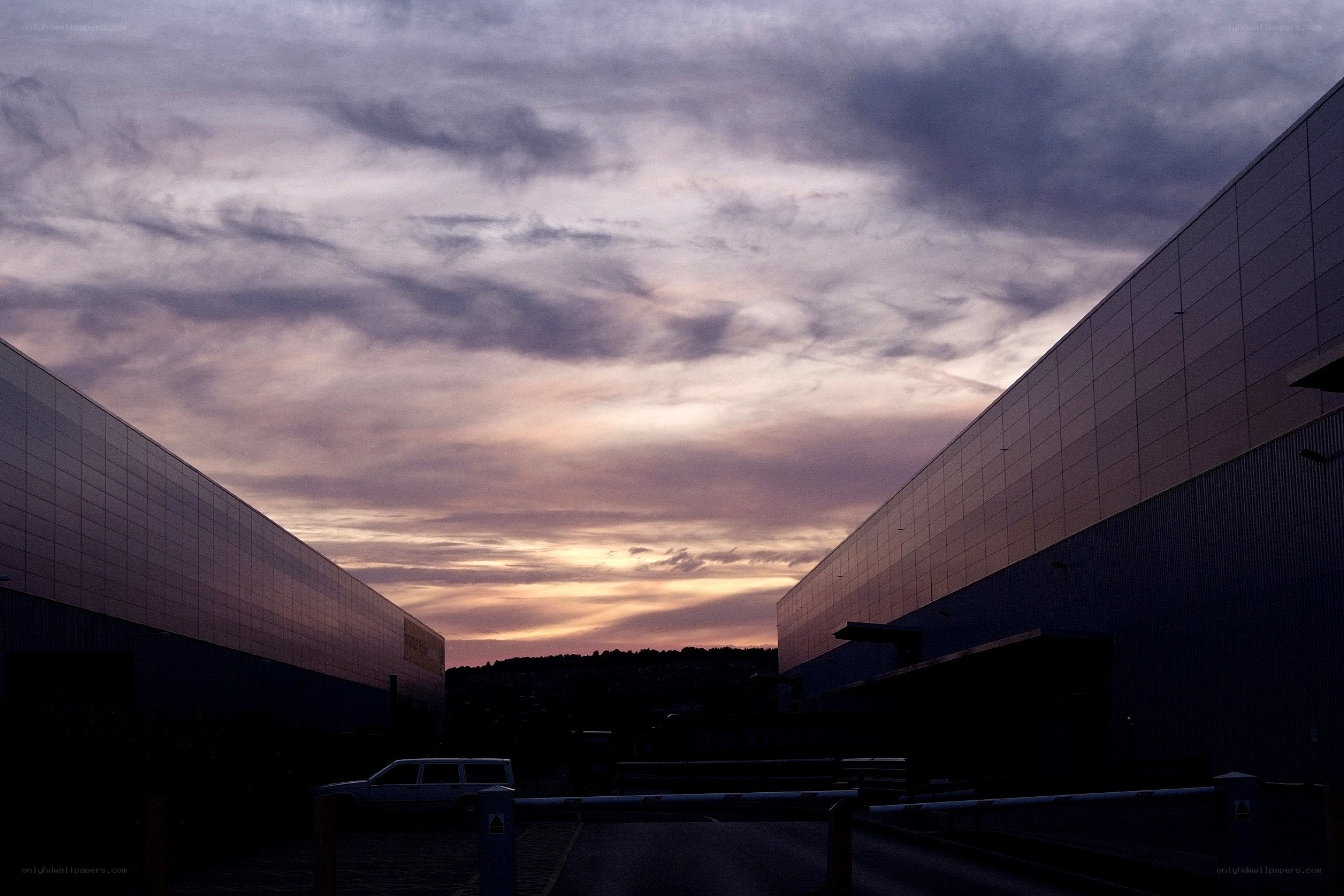 Sunset between modern buildings