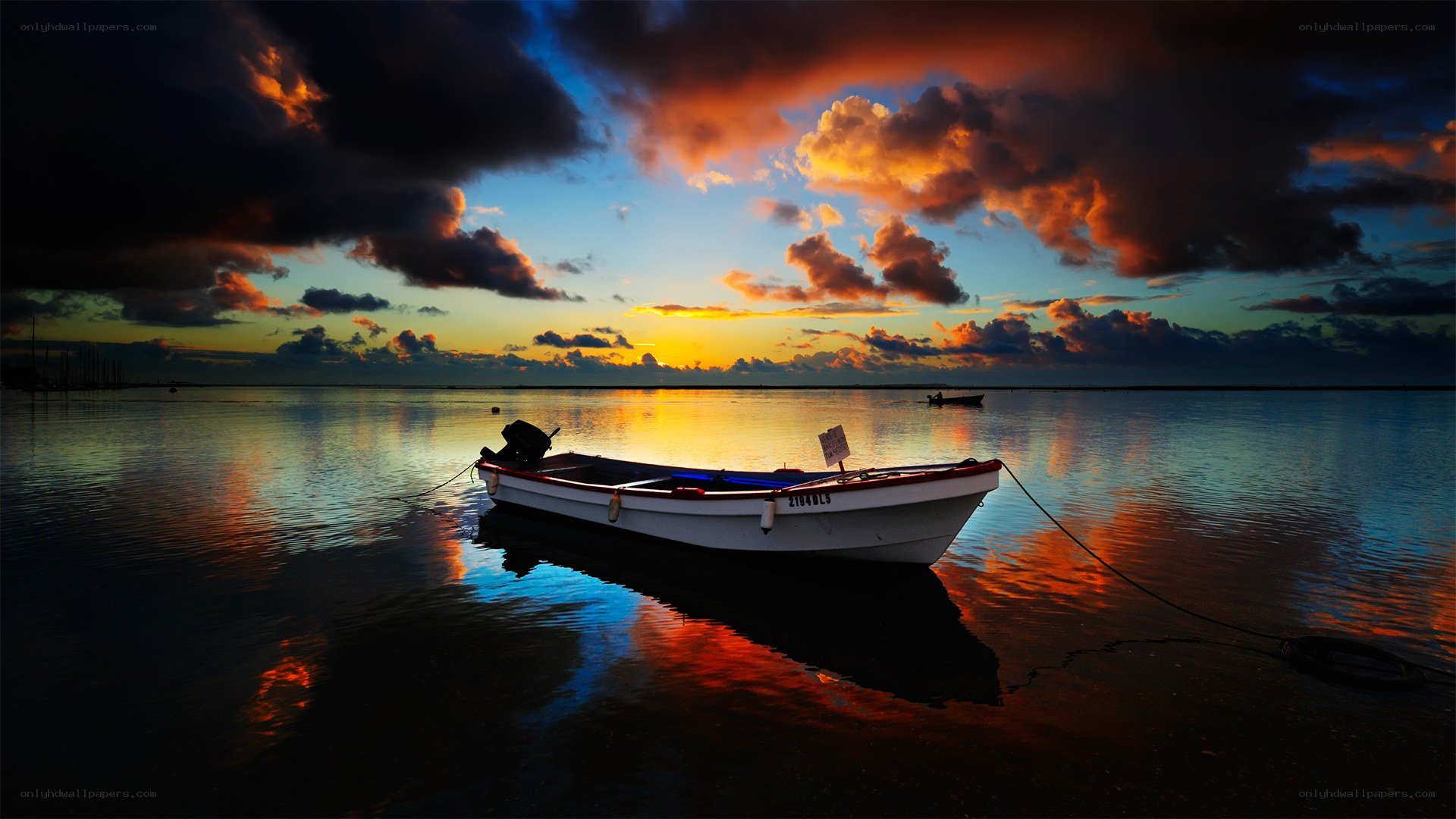 Sunset boat on calm water