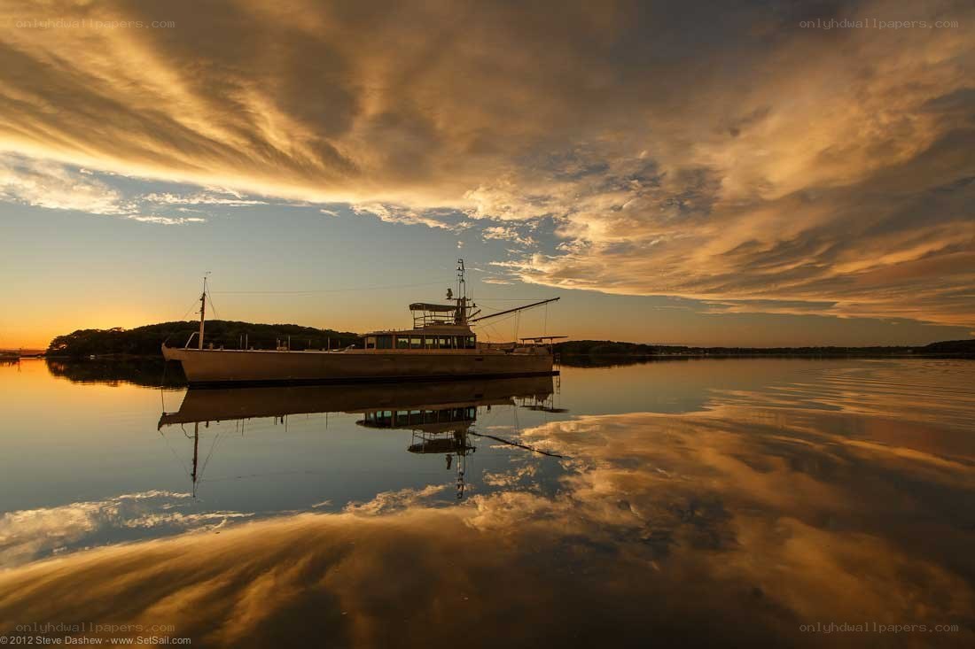 Sunset boat reflection