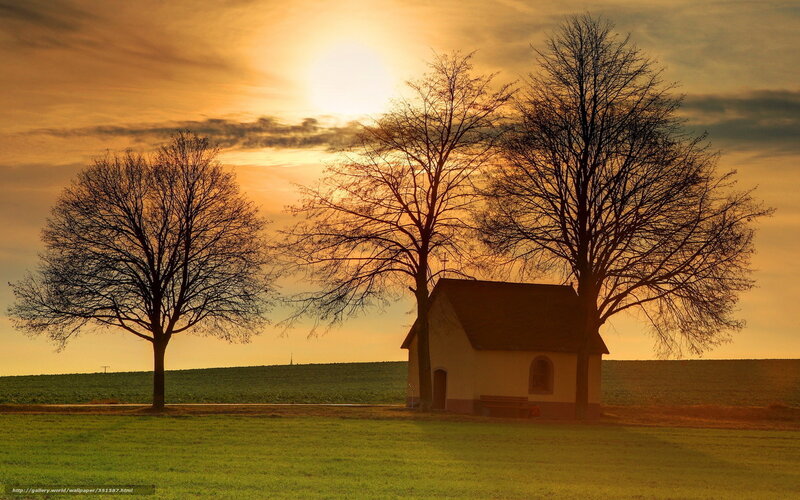 Sunset by a small chapel