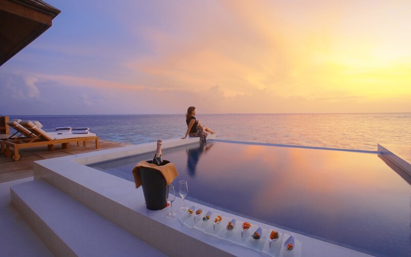Sunset by the infinity pool