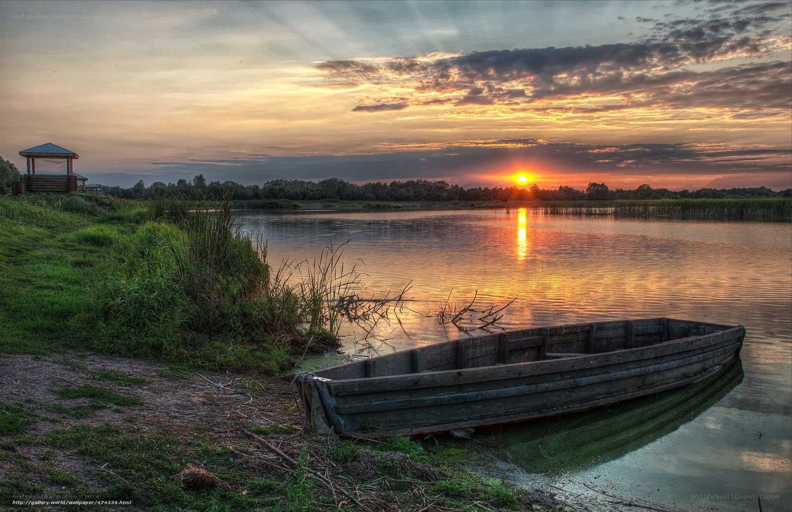 Sunset by the lake with a boat