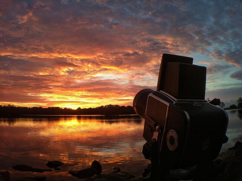Sunset by the lake with camera