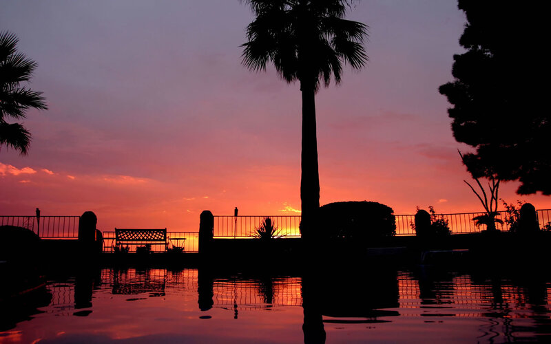 sunset by the pool