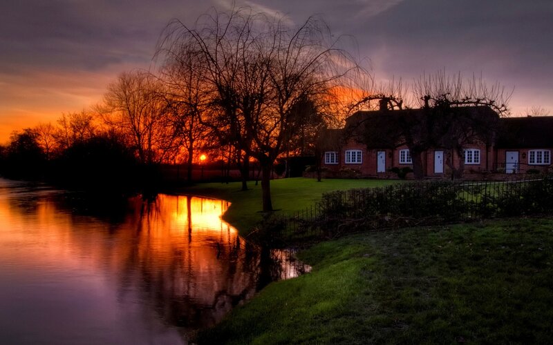 Sunset by the river cottage