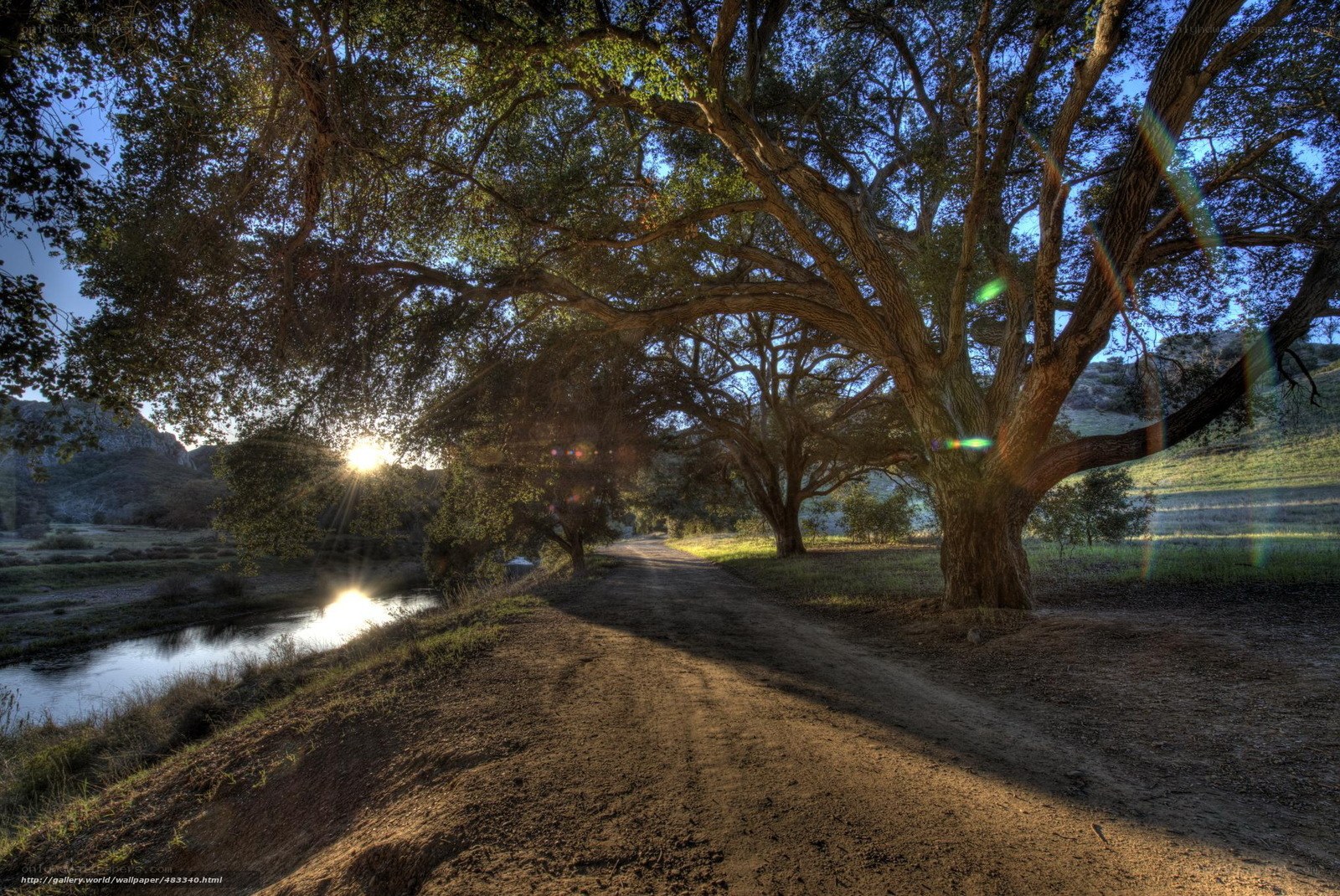 Sunset by the river path
