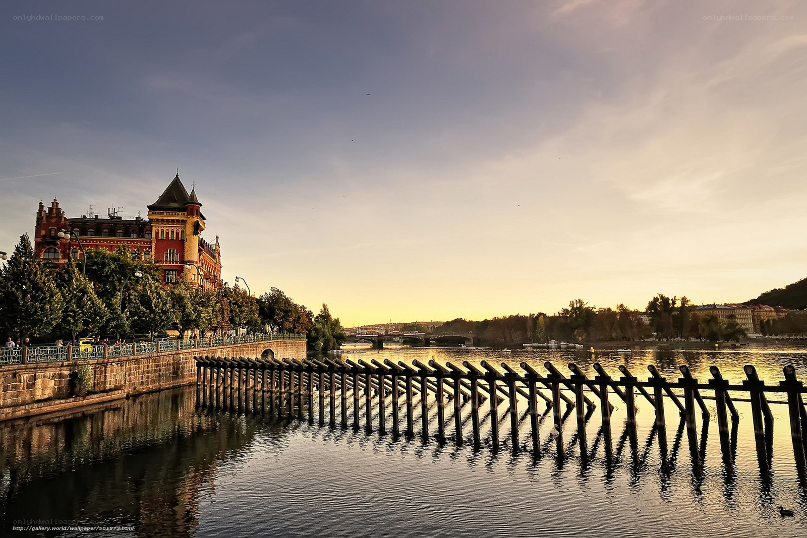 Sunset by the river with historic building