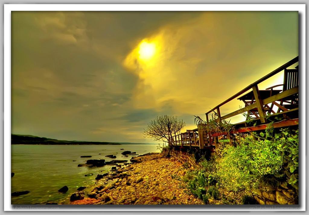 Sunset by the rocky shore