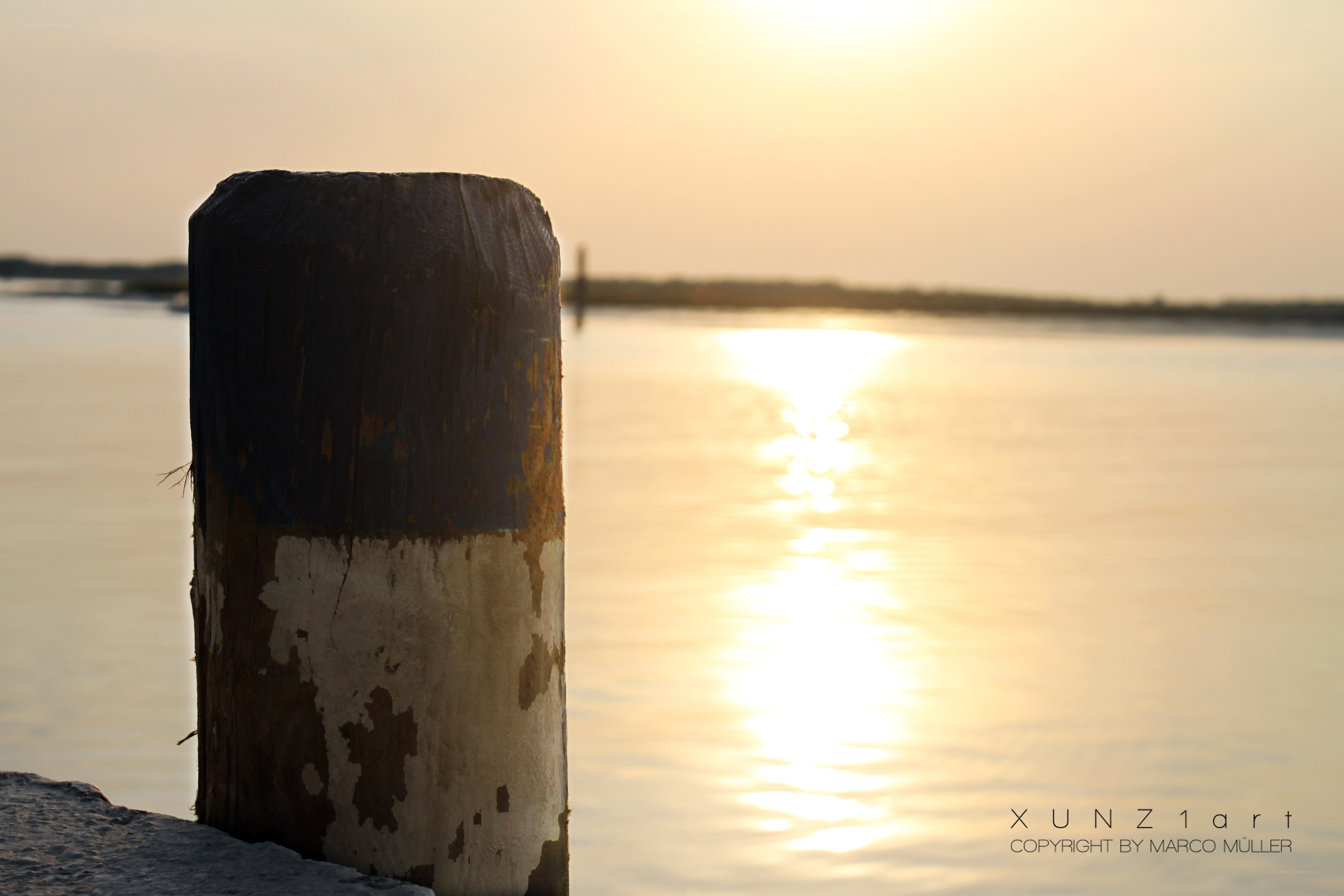 Sunset by the water