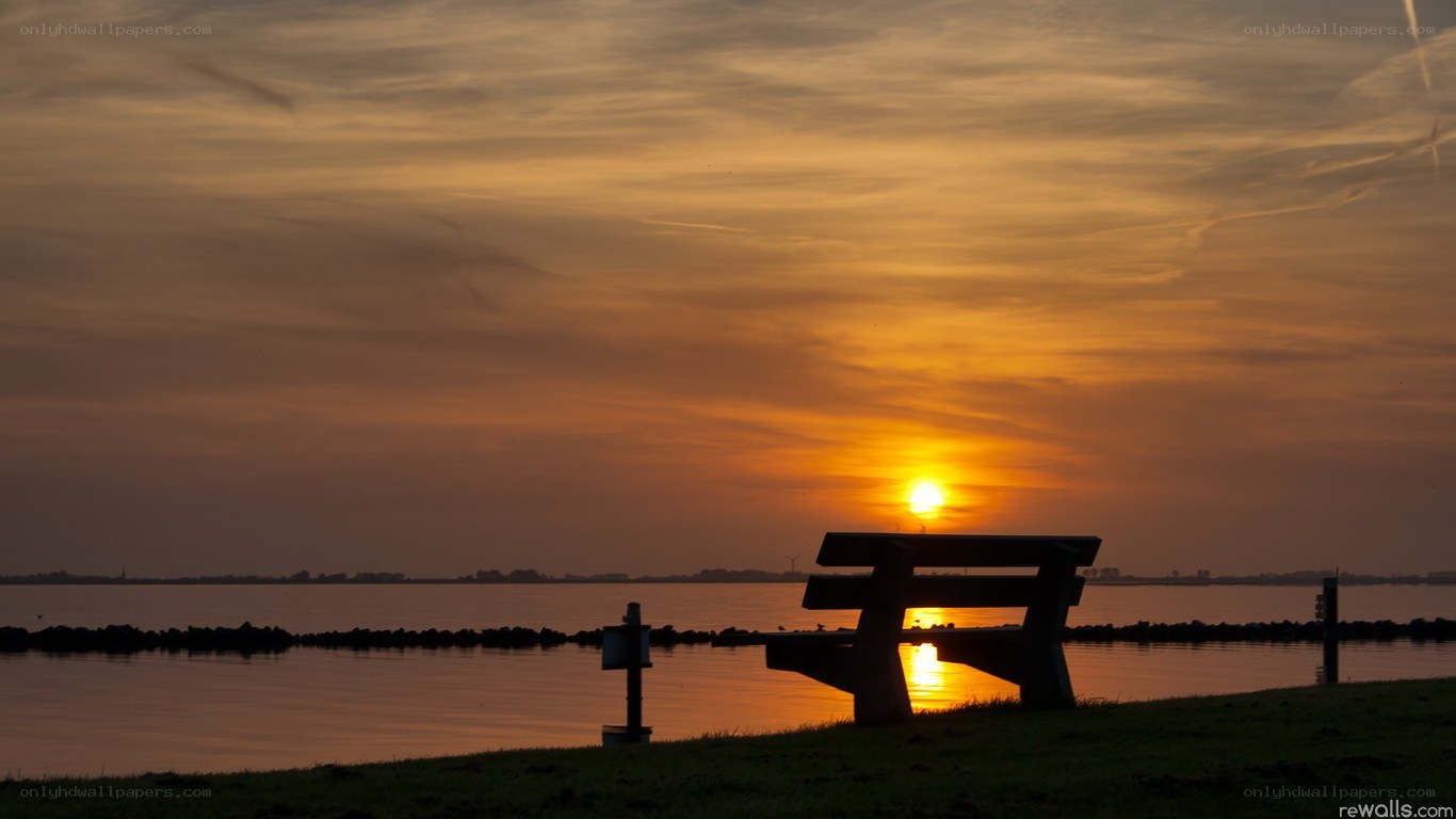 Sunset by the water