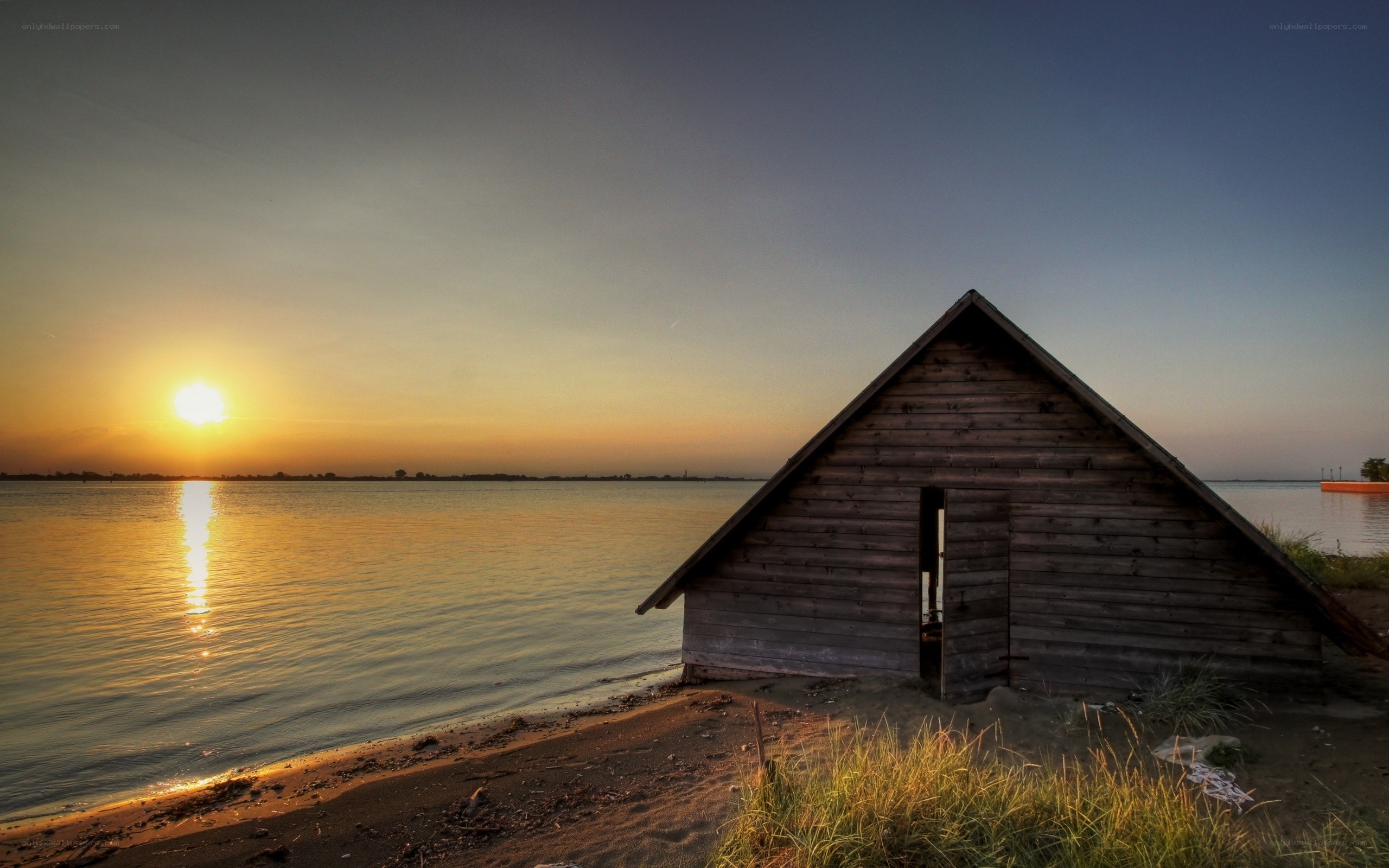 Sunset by the wooden hut