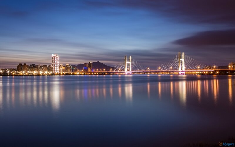 Sunset Cityscape with Bridge