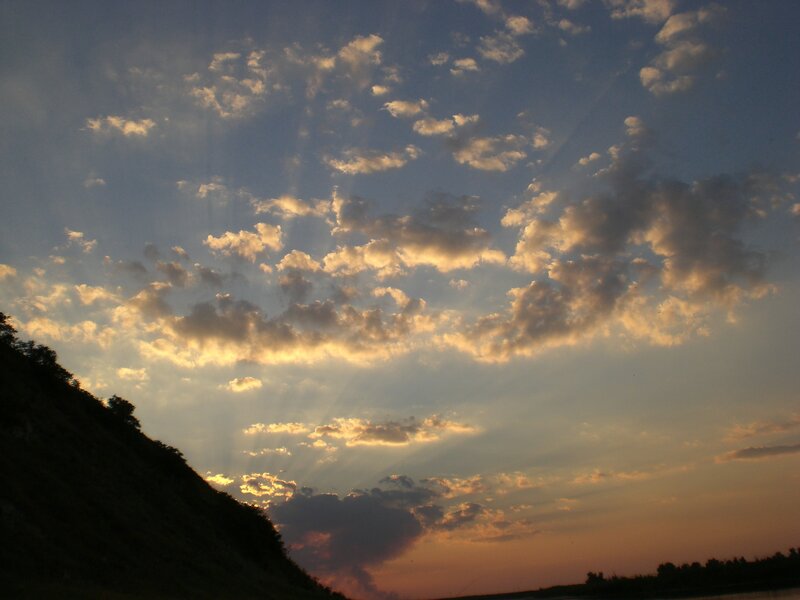 Sunset clouds over a river