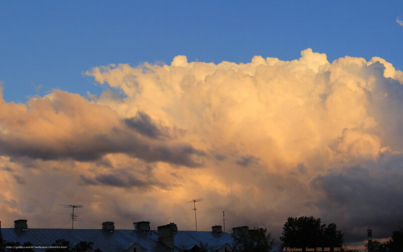 Sunset clouds over rooftops