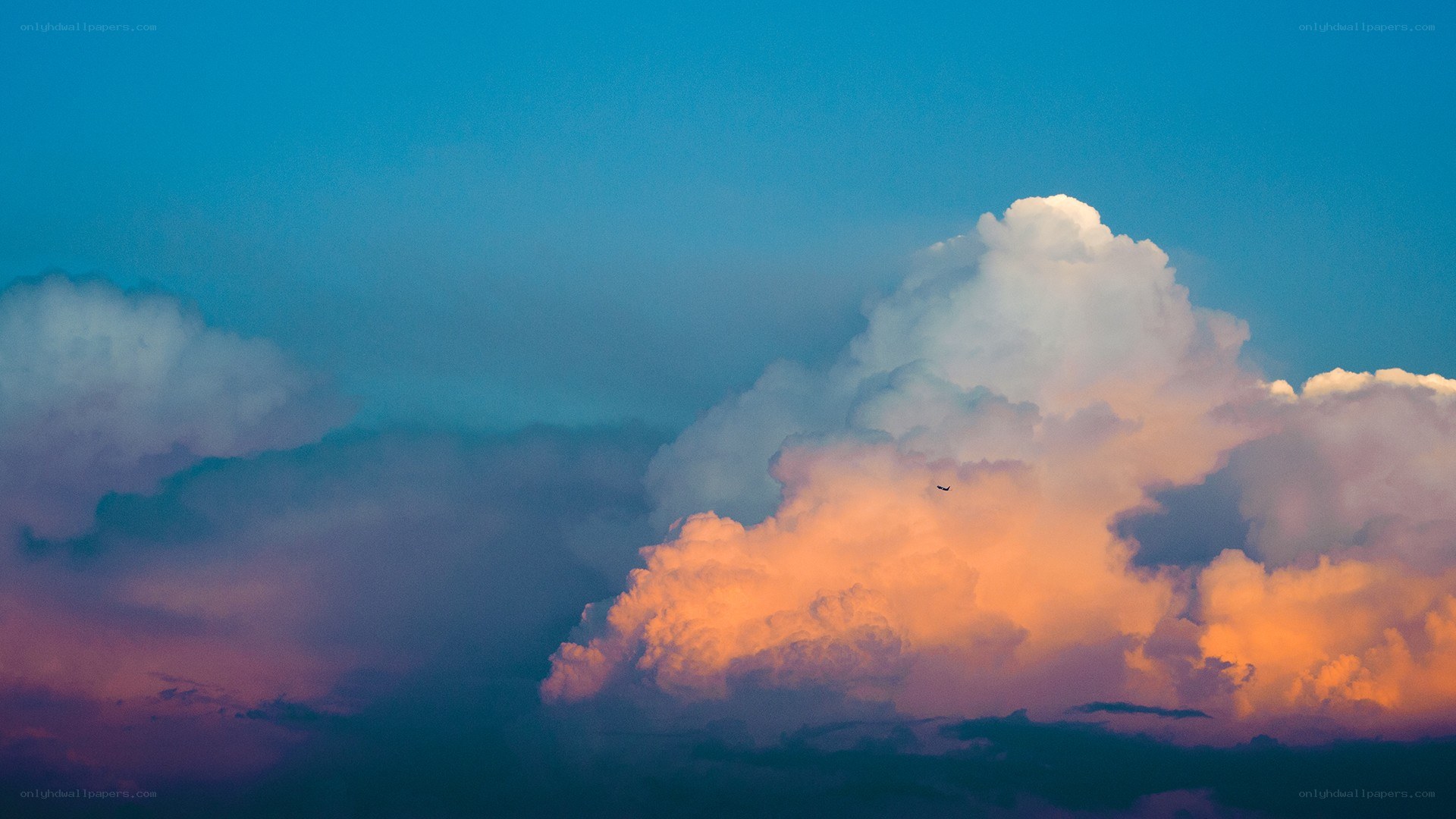 Sunset clouds with airplane