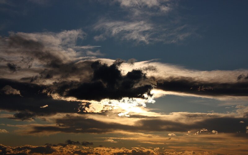 Sunset clouds with airplane