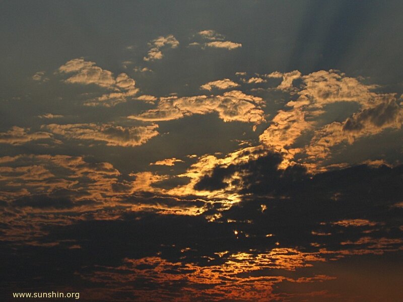 Sunset clouds with sunbeams