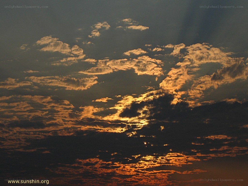 Sunset clouds with sunbeams