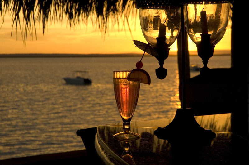 sunset cocktail by the water