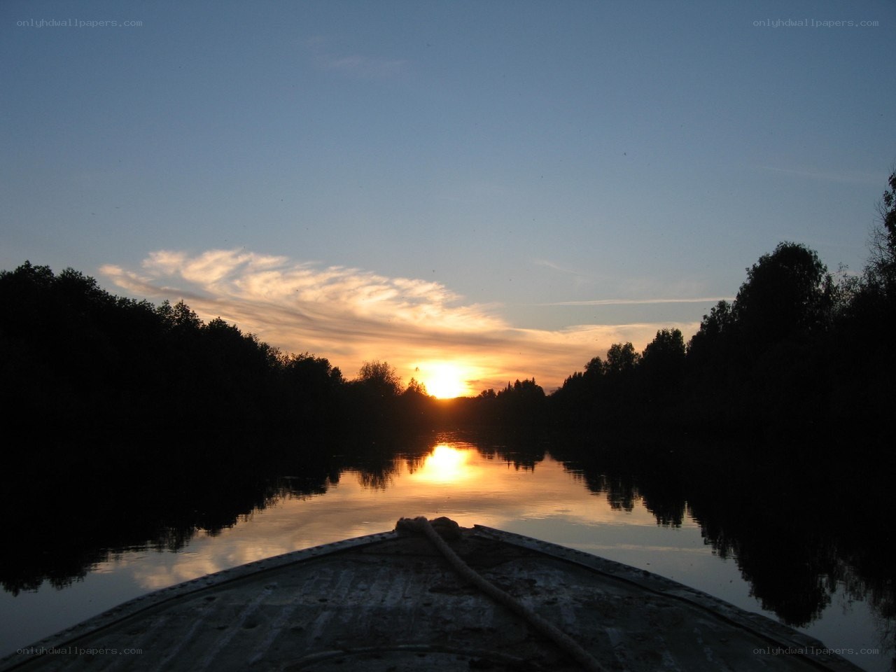 Sunset from a boat on a river